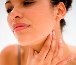 By hurting the lymph nodes in the neck